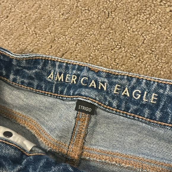 Size 0 American Eagle blue Asymmetrical Jean Shorts. Brand New, never worn. - Picture 3 of 4